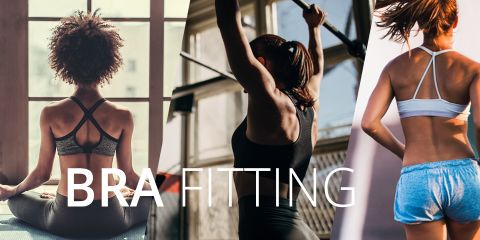 Drei Frauen von hinten, jede in Sport-BHs. Die erste sitzt im Schneidersitz in einer Yoga-Pose, die zweite stemmt Gewichte und die dritte steht mit den Händen in den Hüften. Der Text „BH-ANPASSUNG“ überlagert das Bild.