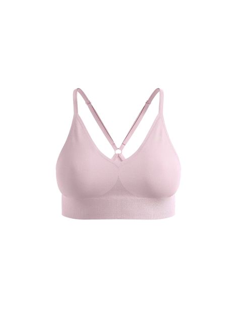 Hellrosa nahtloser Bralette mit verstellbaren, überkreuzten Trägern auf weißem Hintergrund.