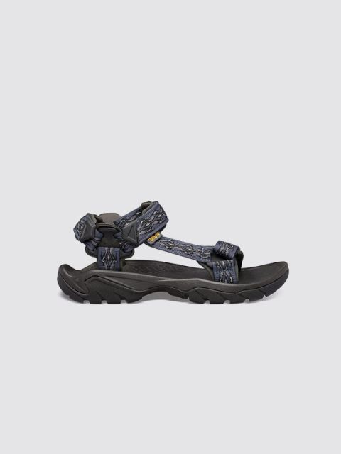 Eine grün-schwarze Sandale mit verstellbaren Riemen ist auf hellgrauem Hintergrund abgebildet. In der oberen linken Ecke steht in fetten, weißen Buchstaben das Wort „SANDALEN“.